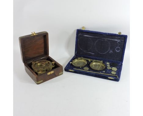 A cased set of scales, together with a ships compass, cased, 14cm wide