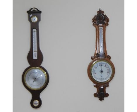 An early 20th century light oak cased aneroid barometer, 88cm high, together with a wheel barometer