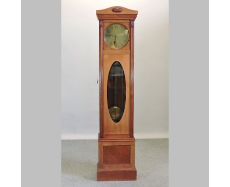 A 20th century mahogany cased longcase clock, the brass dial showing Arabic numerals, 210cm