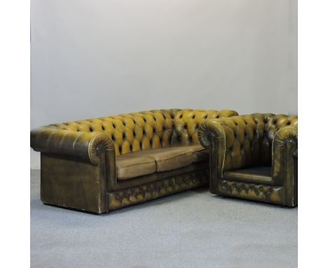 A leather upholstered button back Chesterfield sofa, 206cm, together with a matching armchair