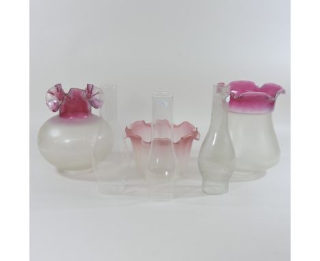 Three various glass oil lamp shades, together with three glass funnels