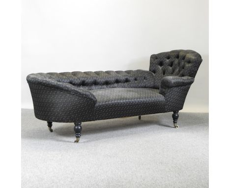 A 19th century black upholstered button back chaise longue, 187cm