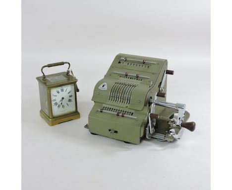 An early 20th century brass cased carriage clock, together with an early 20th century Brunsviga German mechanical calculator,