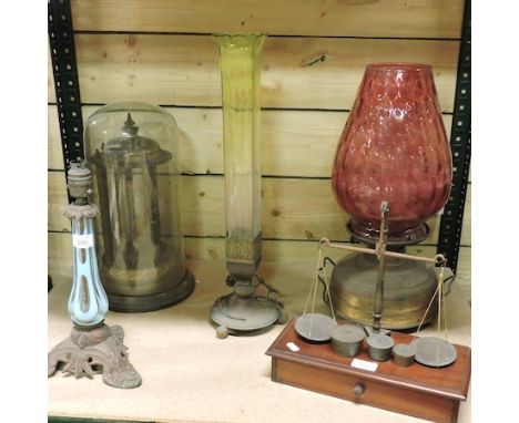 A 19th century glass dome, 40cm high, together with an oil lamp, postal scales and other items