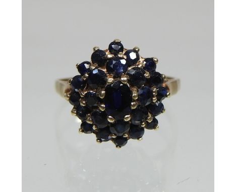 A 9 carat gold sapphire cluster ring, boxed