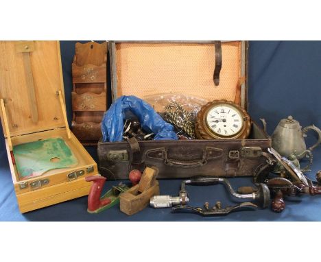 Suitcase containing late Victorian rope twist wall clock, woodworking tools, table top easel box, bakelite door knobs, statio