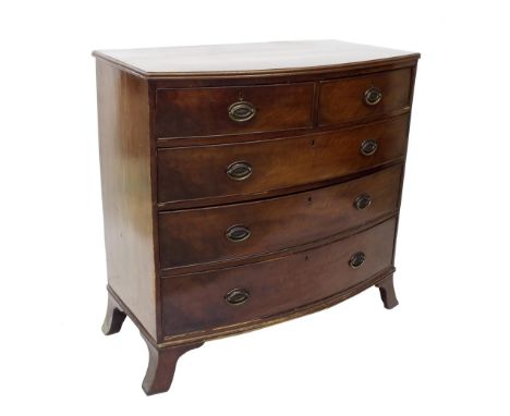 Late Georgian flame mahogany bowfront chest of drawers fitted with two short over three long drawers upon splayed bracket fee