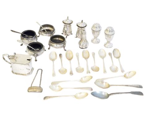 A selection of silver, to include nine rat tail pattern teaspoons, four open salts, shakers, spirit label, etc, gross weight 