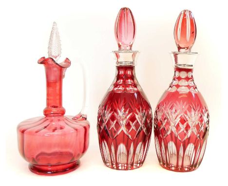 A pair of flash ruby decanters with silver-plated mounts, also one other cranberry decanter.28.5mm high.Condition report: The