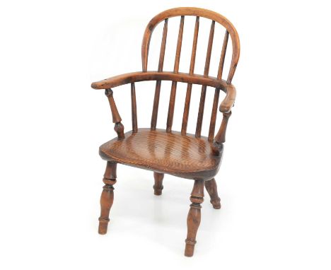 Mid 19th century yew and elm child's low back Windsor chair, spindle back with saddle seat, ring turned legs.width 37cm (15")