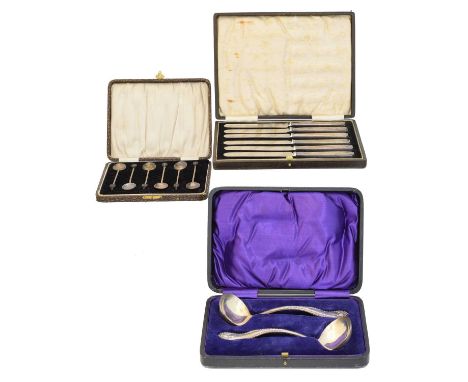 Three cased sets of flatware, to include silver handled knives, coffee spoons and one other, gross weight of solid silver ite