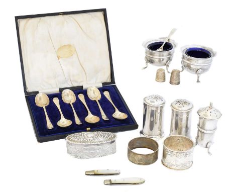 A selection of silver, to include a cruet set, silver lidded jar, mother of pearl fruit knives and cased set of teaspoons, gr