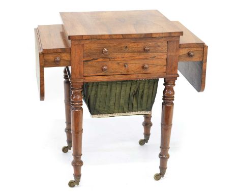 Victorian rosewood veneered sewing table, the rectangular top with two drop leaves, rise and fall writing slope, four drawers