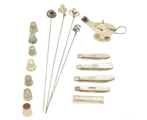 A selection of silver, to include a silver novelty genie table lamp, four silver and mother of pearl fruit knives, hat pins, 