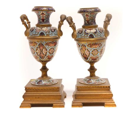 Pair of champlevé garnitures, with twin handles on square bases, 21cm high Condition report: One vase misshapen. The other ha