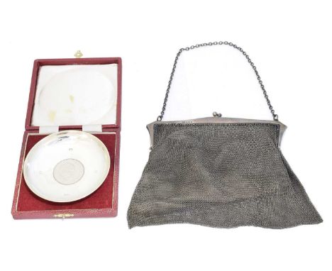 A silver mesh purse, together with a Churchill commemorative dish in fitted case, gross weight of dish 2.49ozt.Condition repo