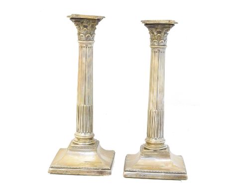 A pair of Victorian silver candlesticks, Rupert Favell, London, 1886, height 27cm.Condition report: Overall condition fair to