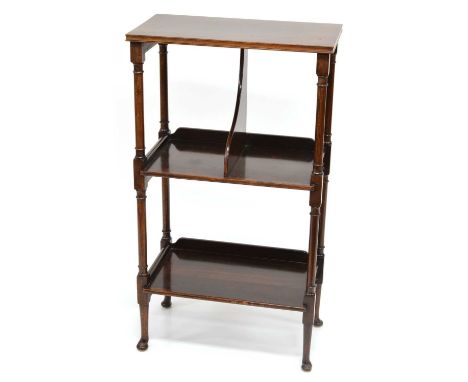 Late 19th century figured mahogany book stand, three rectangular shelves supported on ring-turned columns with four pad feet.