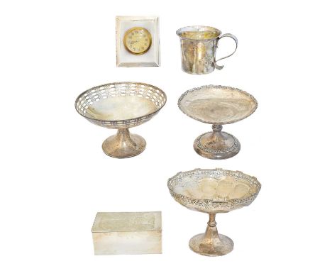 A selection of silver, to include three tazzas, a mug, cigar box and a silver fronted clock, gross weight of solid silver ite