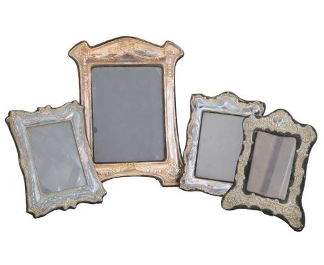 Four Elizabeth II silver fronted frames, Douglas Pell Silverware, London, 1988-9 (4).Condition report: Overall condition good