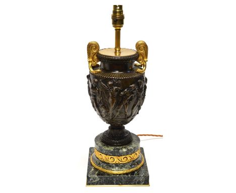 Late 20th-century bronze, brass and marble table lamp of classical design, the urn-shaped body decorated with figures.height 