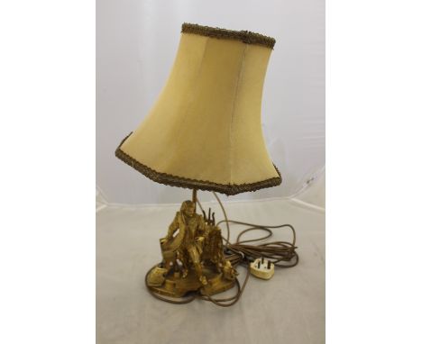 An early 20th Century gilt metal electric table lamp, in the form of a 17th Century artist, height excluding shade 34cm