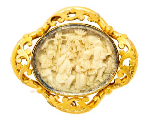 A Victorian gold and ivory oval brooch, the centre set with an oval ivory panel, carved with four Chinese figures beneath a w