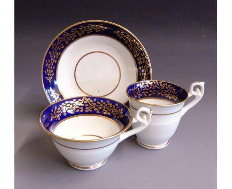 An English porcelain trio, tea and coffee cup and saucer, cobalt blue and gilt borders, pattern No.2721, probably Spode but a