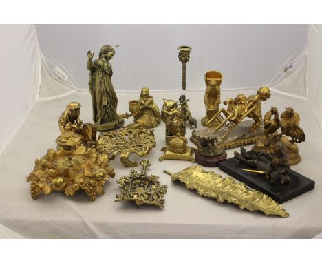 A collection of assorted decorative cast brass and gilt metal ornamental figures, to include a classically draped maiden with