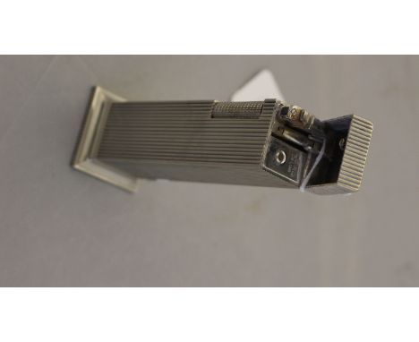 An Art Deco Lord DeLuxe column shaped cigarette lighter, fluted body, spreading base, 12cm high