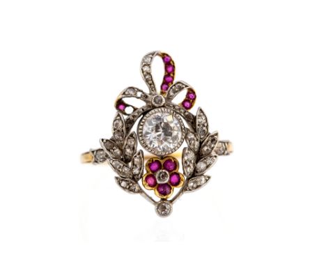 A late Victorian/Edwardian diamond and ruby garland style ring, floral, leaf and bow design comprising a central round old cu