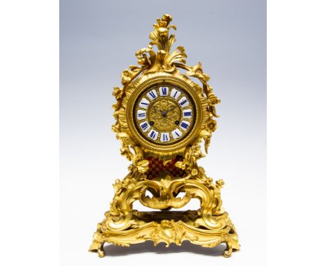 A 19th Century French cast ormolu bracket clock, of Louis XV Rococo design, inset enamel Roman numerals, integral raised plin