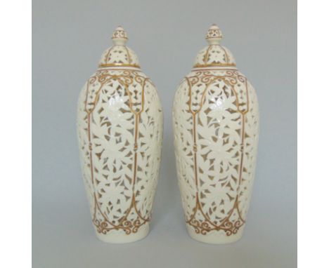 A pair of Graingers Worcester reticulated vases and covers,  decorated with gilt rims and borders, 1870-89, impressed shield 