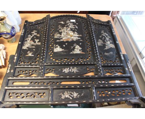 A late 19th century mother of pearl inlaid and lacquered fire screen in Chinoiserie style