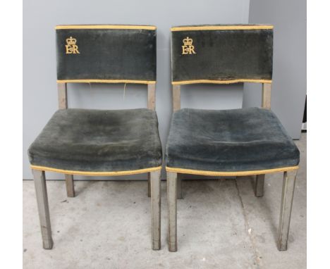 A pair of 1953 Elizabeth II Coronation ceremony chairs, blue upholstered seats and backs, gold braid, the backs bearing the '