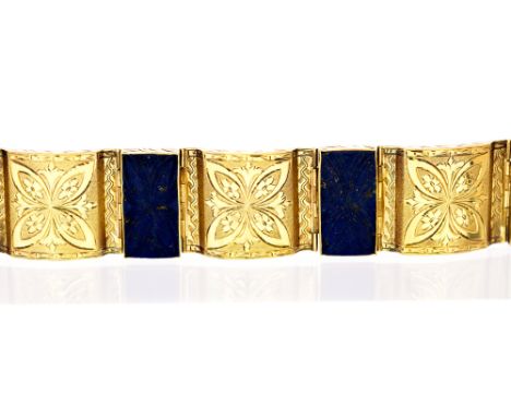 A lapis lazuli and 14ct yellow gold bracelet, four stylised floral carved lapis lazuli panels, alternating with curved yellow