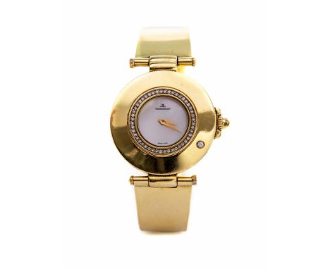 Jaeger Le Coultre, a lady's 18ct gold Jaeger Le Coultre wristwatch, 3cm circular mother of pearl dial with diamond set bezel 