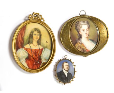 Three oval portrait miniatures, 19th/early 20th Century, two beautiful ladies and a pendant miniature of a gentleman with loc