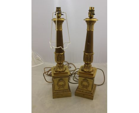 A pair of 20th Century gilt metal column table lamp bases, of neo-classical design, height 50cm (2)