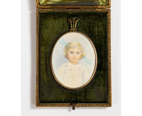 Gertrude Massey (British, 1868-1957), an oval portrait miniature of a child wearing a white dress, signed, 7cm by 6cm, in a f