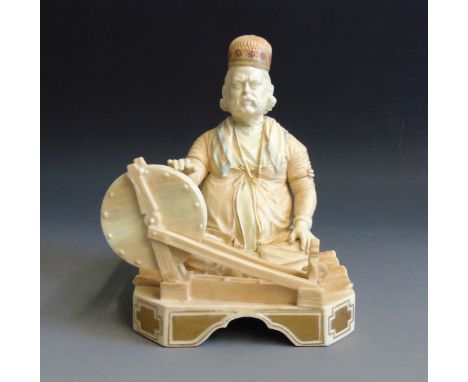 A rare Royal Worcester figure of an Indian Craftsman, picked out in blush ivory and gilt, circa 1855 date code, 12cm wide,  1