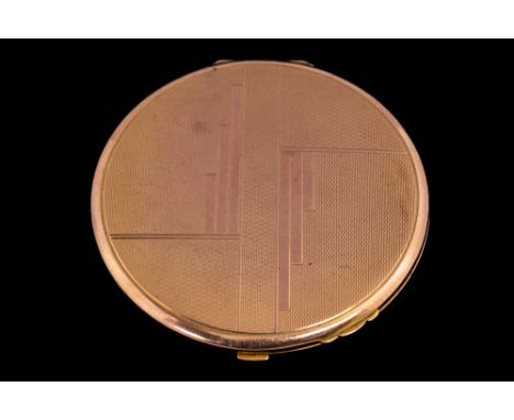A 1930s Art Deco, 9ct rose gold circular powder compact, hallmarked Birmingham 1933, with geometric design, engine turned pat