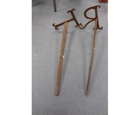 A pair of George III iron tie bars, with initials 'T' and 'R', approx 76cm long 