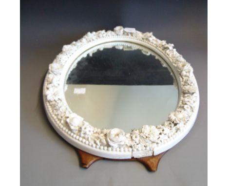 A 19th Century oval easel looking glass, the surround a Derby porcelain floral border in the white, height 46cm (a/f)
