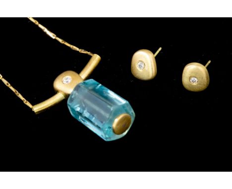 An aquamarine and diamond 18ct yellow gold pendant and earring set of designer jewellery by C.W. Sellors, the pendant compris