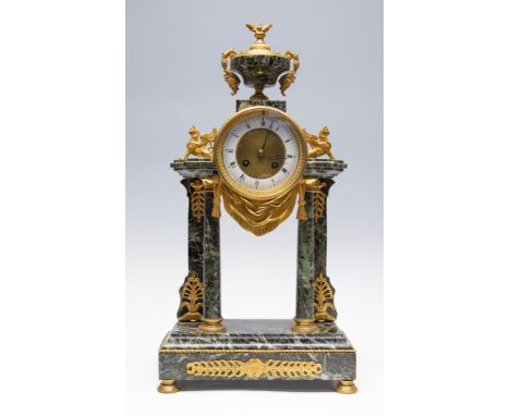 A late 19th Century French green veined marble bracket clock, circa 1880, of Baroque design, gilt metal mounts, white enamel 