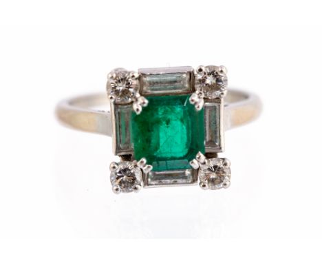 An emerald and diamond square cluster white gold ring by Mauboussin, the central emerald weighing approx 1.25ct the cluster s