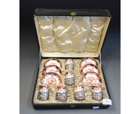 A George V silver mounted Royal Crown Derby coffee can set, No.2412, six can and six saucers, the mounts London 1918 