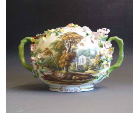 A Minton flower encrusted globe shaped pot and cover with twin handles, the front painted with a church and river scene, the 