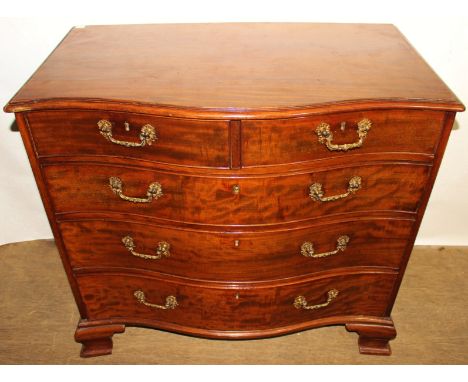 George III mahogany serpentine fronted chest of drawers, comprising two short over three long graduated drawers, raised on br